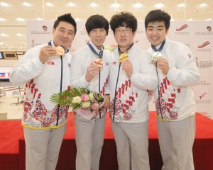 Korea's Kang Hee Won-Shin Seung Hyeon and Choi Bok Eum-Park Jong Woo withing the bronze and gold in the Doubles event